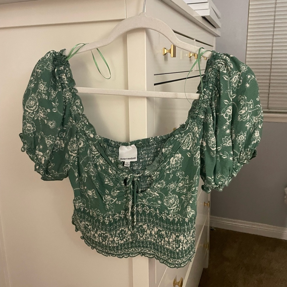 Super cute and flattering puff sleeve top, but only wore it about 4 times.